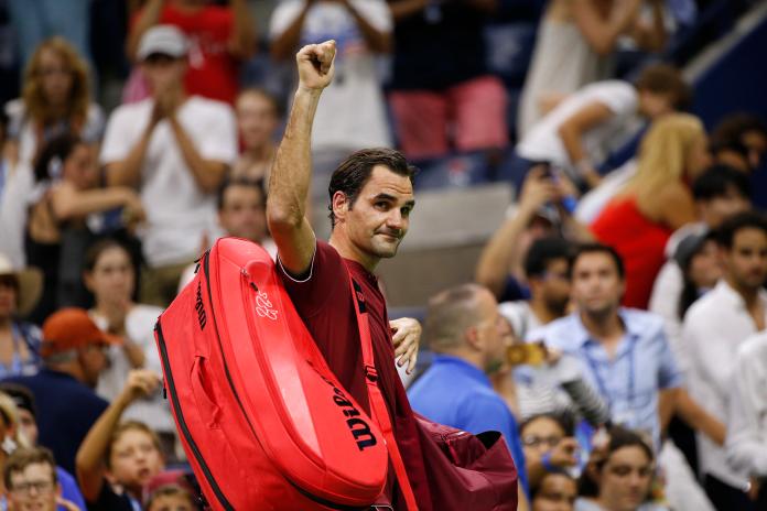 Roger Federer, of Switzerland, waves to the crowd as he leaves the court after losing to John Millman, of Australia, during the fourth round of the U.S. Open tennis tournament early Tuesday, Sept. 4, 2018, in New York. (AP Photo/Jason DeCrow)