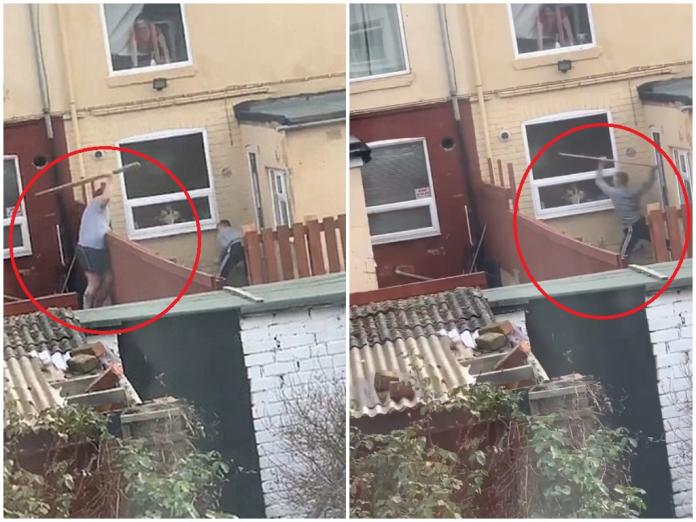 ▲英國網友拍到對面鄰居互拿木板打架的畫面。(圖 / 翻攝自推特)