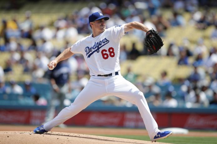 Los Angeles Dodgers starting pitcher Ross Stripling throws against the Milwaukee Brewers during the first inning of a baseball game, Sunday, April 14, 2019, in Los Angeles. (AP Photo/Jae C. Hong)