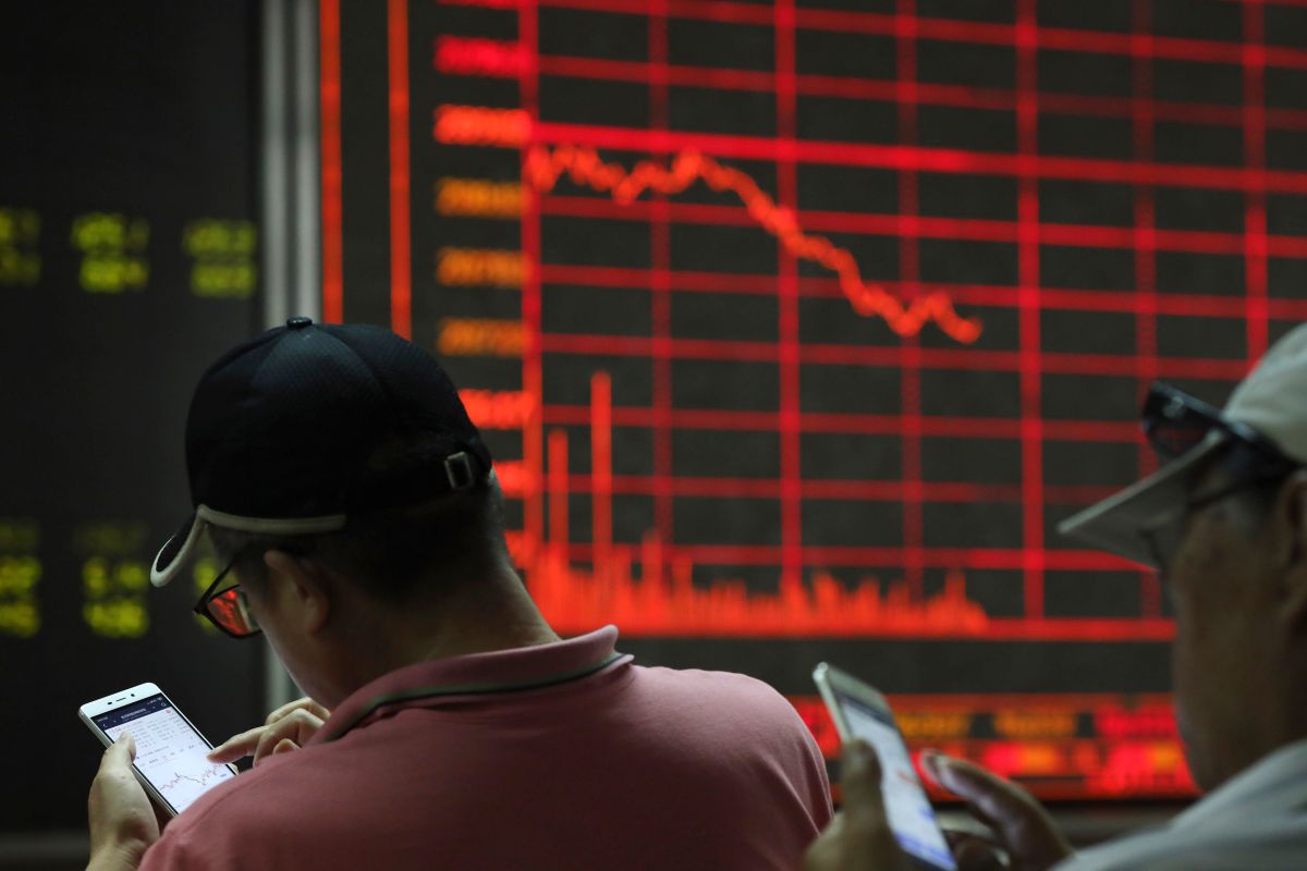 ▲港股持續探底，恒生指數跌至13年半新低。（圖／美聯社／達志影像）