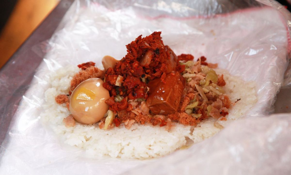 ▲有網友在 PTT 女孩版好奇詢問，大家可以接受飯糰裡面有「菜脯」嗎？貼文立刻引發網友論戰，更有許多人點名另一「顧人怨配料」。（圖／NOWnews 資料照 ）