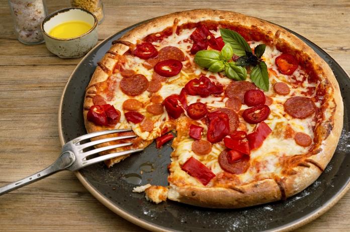 ▲有網友好奇詢問，披薩好吃的關鍵是什麼？引發熱議。而大多人都回答是「鳳梨」。（示意圖／翻攝自 Unsplash ）
