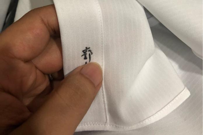 ▲白襯衫送洗後竟然被用奇異筆寫上名字，讓台南哥相當傻眼。（圖／翻攝自 PTT ）
