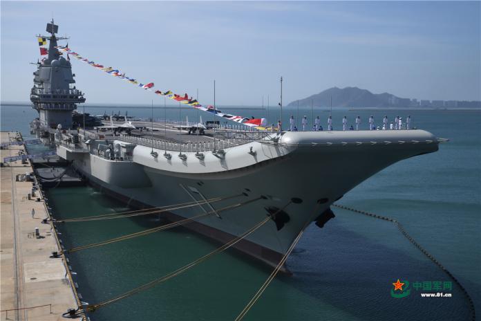 ▲2019年12月17日,中國首艘國產航艦山東號於海南島三亞交艦服役。(圖/中國大陸國防部)