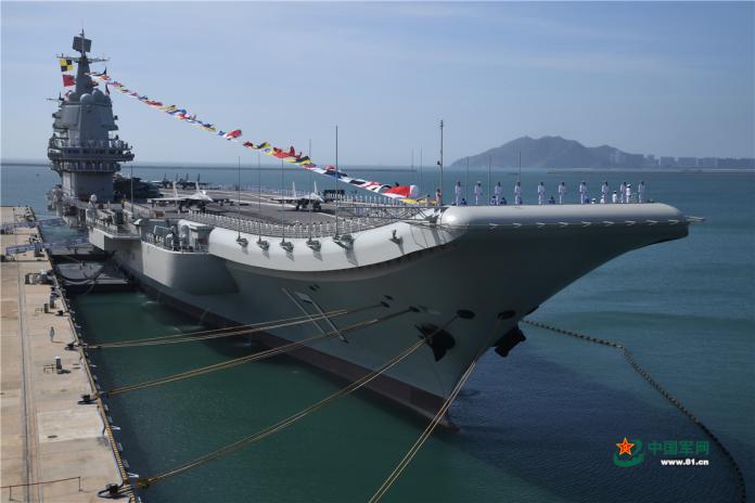 ▲2019年12月17日，中國首艘國產航艦山東號於海南島三亞交艦服役。（圖/中國大陸國防部）