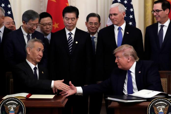 ▲美中簽署首階段貿易協議,開打一年半的貿易戰暫告緩和。(圖/美聯社/達志影像)