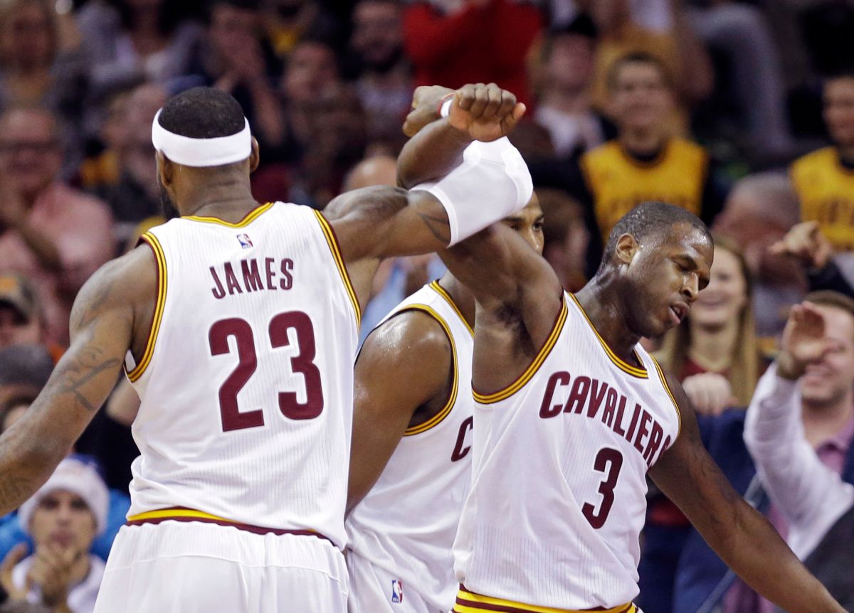 Cleveland Cavaliers' LeBron James (23) celebrates with Dion Waiters (3) in the fourth quarter of an NBA basketball game Sunday, Dec. 21, 2014, in Cleveland. The Cavaliers won 105-91. (AP Photo/Mark Duncan)