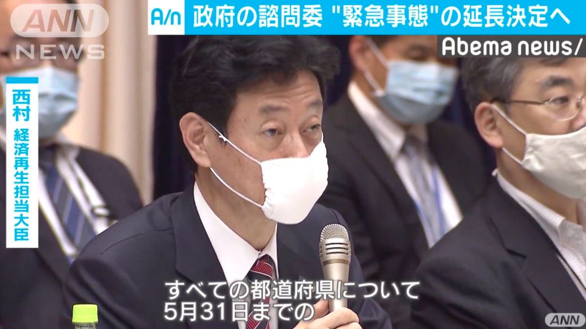 ▲日本口罩供應不足，醫護人員需重覆使用。圖為日本再生經濟大臣、兼新冠病毒大臣西村康稔。（圖／翻攝自 ANN ） 