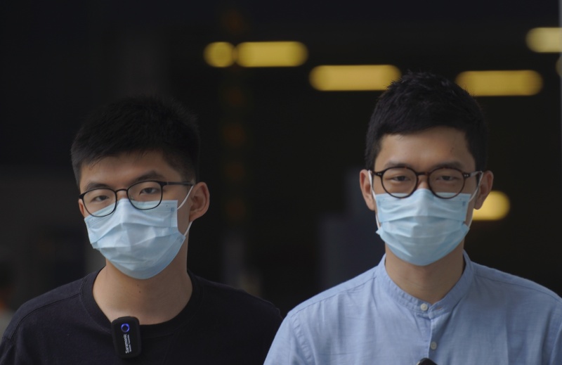 ▲香港眾志前主席羅冠聰(右)與前秘書長黃之鋒(左)。（圖／美聯社／達志影像）