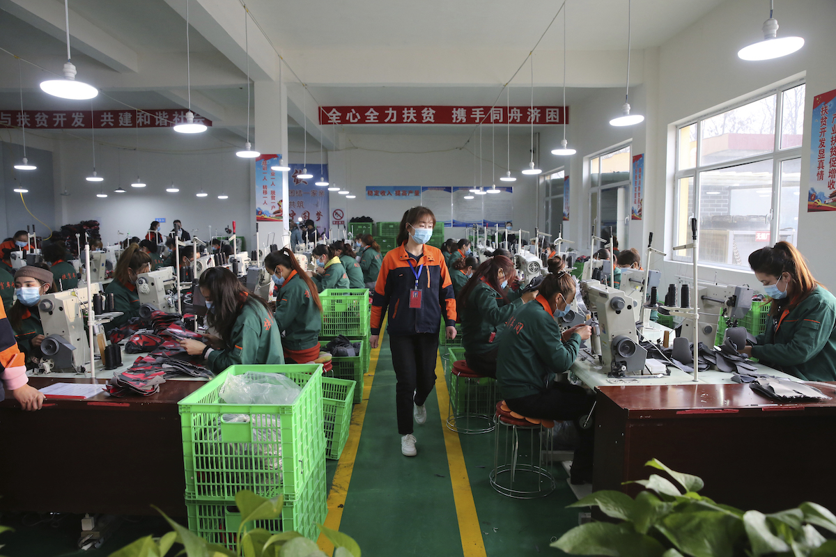 ▲距離農曆過年還有半個月，但中國已有不少人放下工作提前返鄉，多家工廠出現嚴重缺工。資料畫面。（圖／美聯社／達志影像