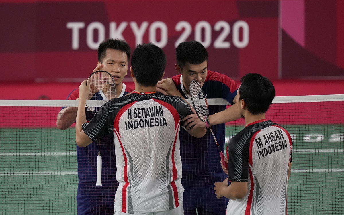 ▲台灣羽球黃金男雙「麟洋配」王齊麟、李洋挺進金牌戰，確定會帶回我國首面奧運羽球獎牌。（圖／美聯社）