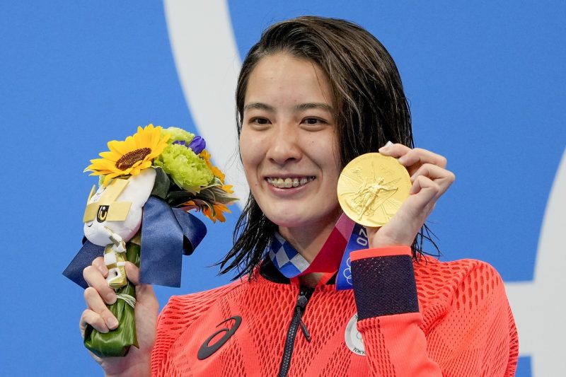 Yui Ohashi, of Japan, poses with her gold medal after winning the women’s 200-meter individual medley final at the 2020 Summer Olympics, Wednesday, July 28, 2021, in Tokyo, Japan. (AP Photo/Martin Meissner)