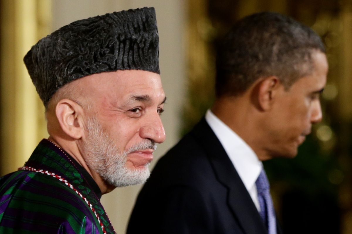 ▲外媒引述消息人士透露，阿富汗前總統卡賽（左）已遭塔利班軟禁。資料照。（圖／美聯社／達志影像）