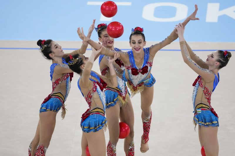Gymnasts from Uzbekistan perform during the rhythmic gymnastics group all-around qualifier at the 2020 Summer Olympics, Saturday, Aug. 7, 2021, in Tokyo, Japan. (AP Photo/Ashley Landis)