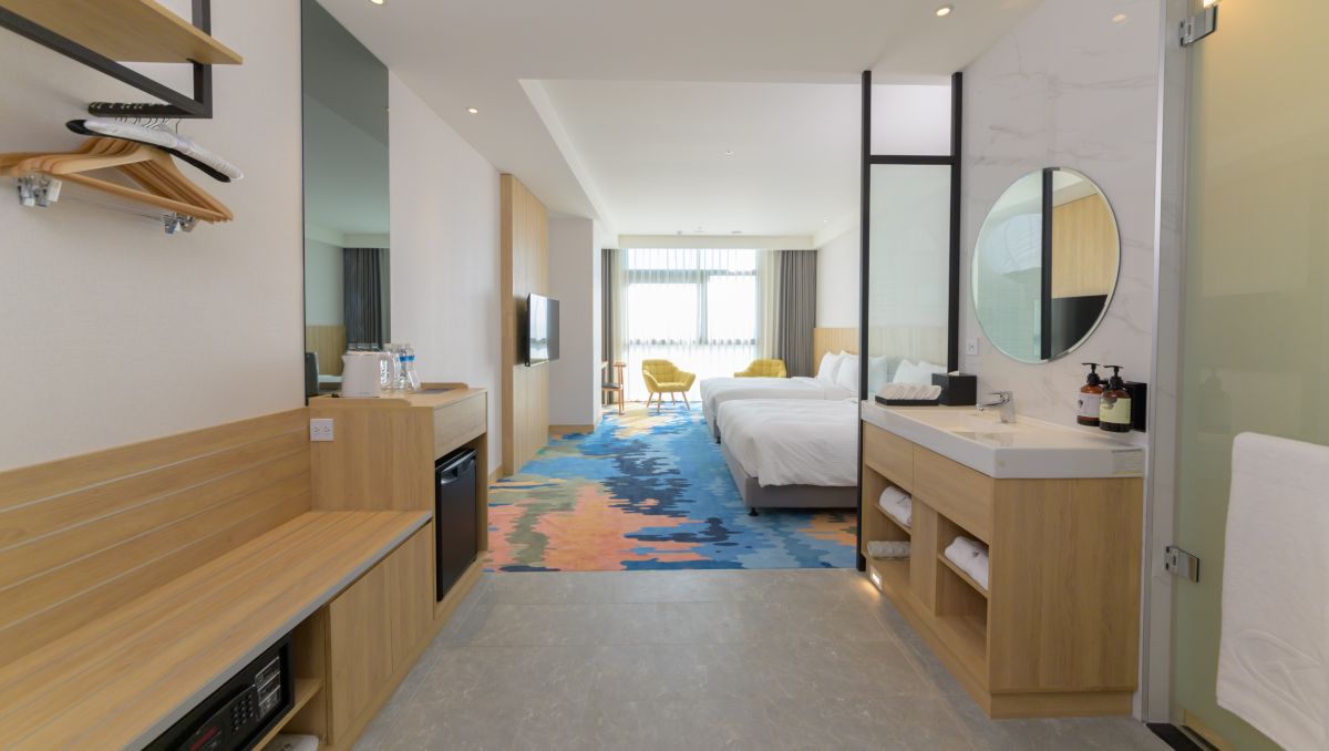 ▲「台中震大金鬱金香酒店」正式對外試營運，推出姓名優惠活動，對中3字就能免費住一晚，圖為溫馨家庭房。（圖／業者提供）