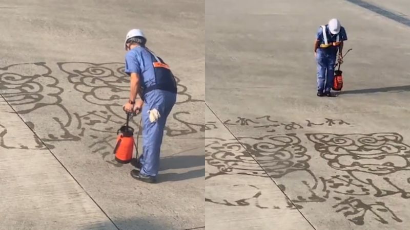 ▲日前在日本沖繩的那霸機場，不幸出現出現班機延誤的情況，但地勤人員卻利用水槍畫出兩隻當地象徵性的「風獅爺」。（圖／翻攝Twitter@kanetomo0331）