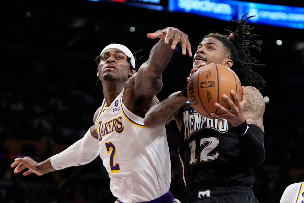 ▲Ja Morant切入上籃，防守球員攔阻不及。（圖／美聯社／達志影像）