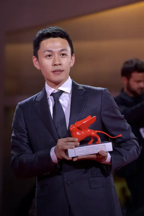 ▲李鴻其（如圖）曾在威尼斯影展獲獎，台上致詞時公開宣告與女星王紫璇是一對。（圖／美聯社／達志影像）