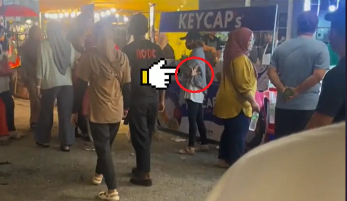 ▲日前在馬來西亞有民眾在逛夜市時，目睹一對情侶逛街，但走在後方的女子還不斷比出「540」手勢，讓他立刻察覺事有蹊俏。（圖／TikTok＠hazrulhaliliceokaw）