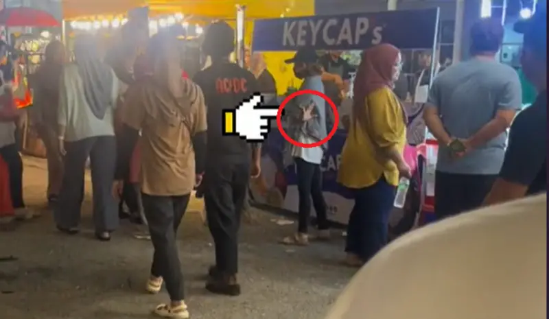 ▲日前在馬來西亞有民眾在逛夜市時，目睹一對情侶逛街，但走在後方的女子還不斷比出「540」手勢，讓他立刻察覺事有蹊俏。（圖／TikTok＠hazrulhaliliceokaw）