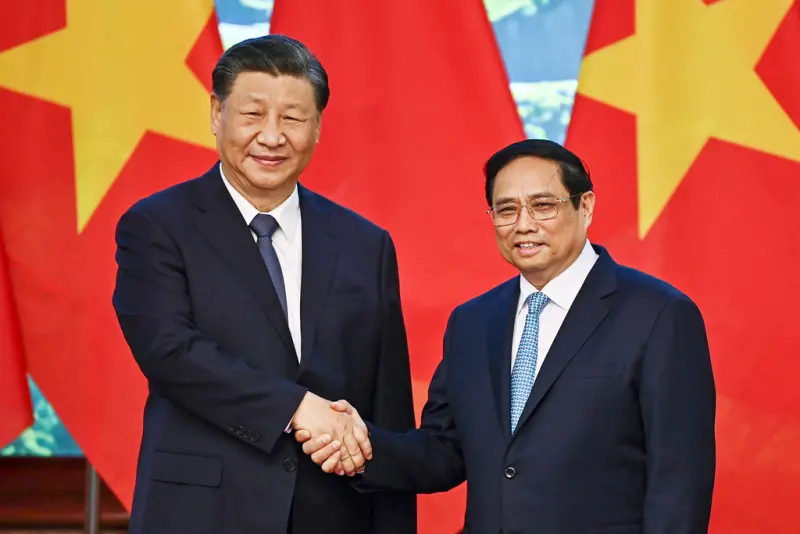 ▲中國國家主席習近平再度會晤越南總理范明政，引發外界關注越南對中美兩國的態度。（圖／美聯社／達志影像）