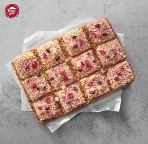 ▲南高屏門市限時推出獨家「加糖放大版」，2月27日起，PK APP單點「爆米香跳跳糖比薩」，限量多加贈一包跳跳糖，數量有限送完為止。（圖／必勝客提供）