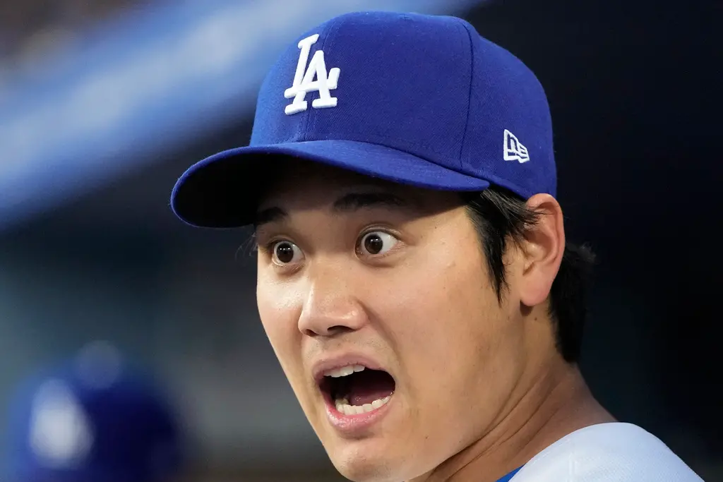 ▲大谷翔平掃出來到道奇生涯後的首轟，但這顆「首轟球」卻鬧出不少風波，道奇球團決定為撿到球的球迷獻上大禮補救。（圖／美聯社／達志影像）