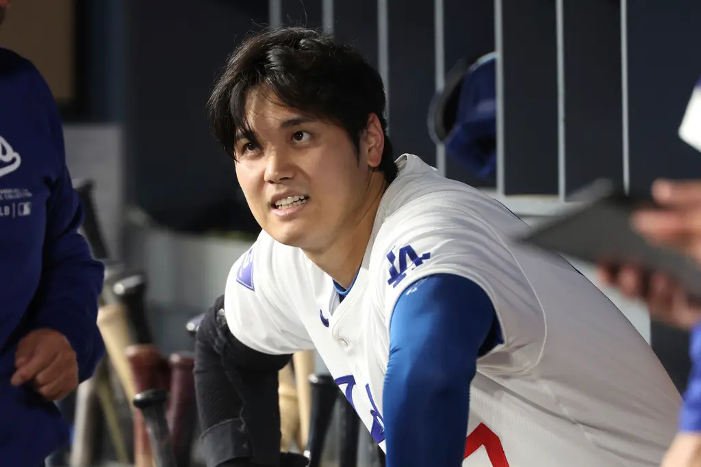 ▲大谷翔平首轟球價值至少至少為10萬美元（約307.4萬台幣），不過昨天撿到這顆球的球迷卻表示道奇並未用他們滿意價值的物品換回它，而是用半強迫的方式要他們交出球。（圖／美聯社／達致影像）