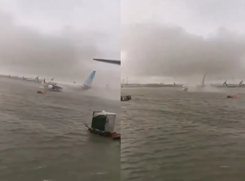 ▲杜拜機場停機坪不敵大雨淹水,飛機試圖在水中滑行。(圖/翻攝自X)