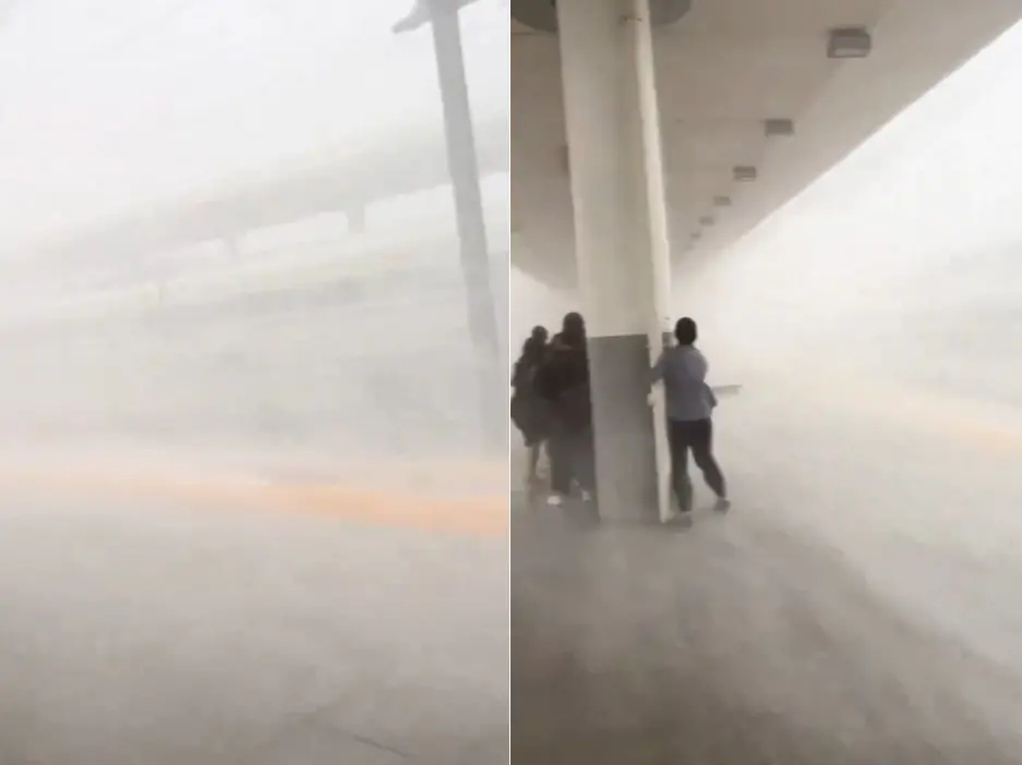 ▲中國廣東四月接連出現極端天氣情形，四月底汕尾車站月台突然颳起狂風暴雨，旅客只能抱柱避難。（圖／翻攝自微博）
