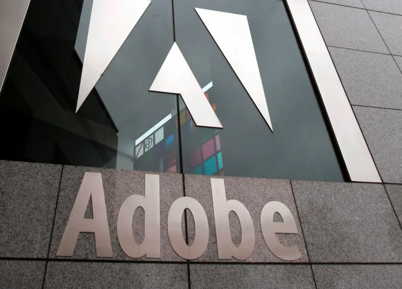 ▲AI題材持續發燒,Adobe上調2024財年全年財測,並將成功部分歸因於將AI功能整合到公司產品中,利多消息也激勵Adobe股價在13日盤後飆漲17%。(圖/美聯社/達志影像)