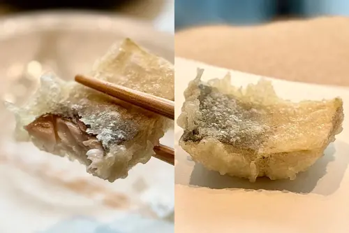 ▲「季節旬魚」看得出藏在薄紗麵衣裡的魚肉仍濕潤充滿水分。（圖／記者蕭涵云攝）