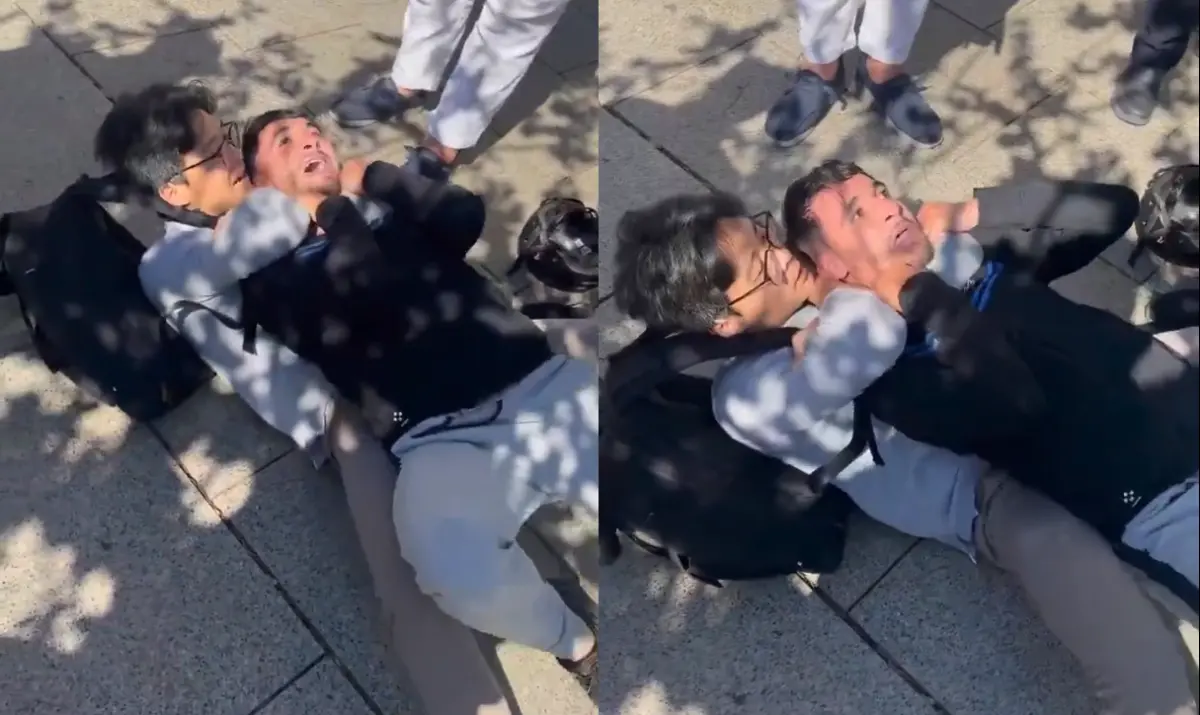 ▲一名旅居西班牙的攝影師遇到搶匪，當場勒喉把搶匪制伏。（圖／翻攝自微博）