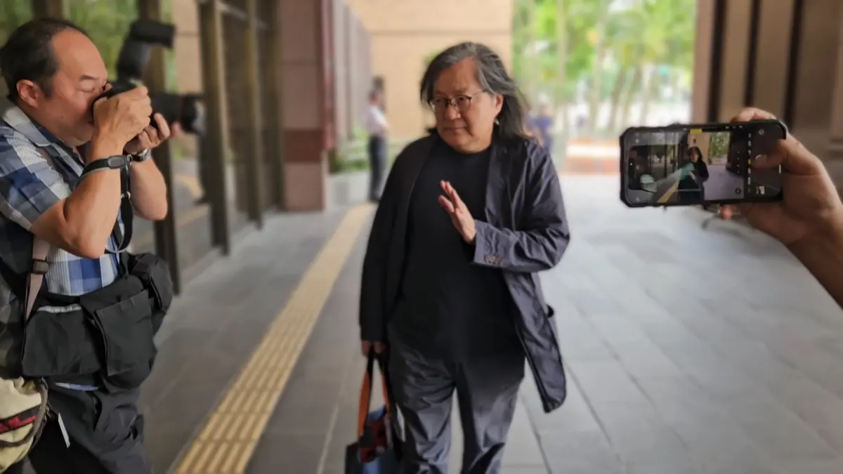 ▲前台北市都發局長林洲民抵達台北地方法院。（圖／記者劉松霖攝）