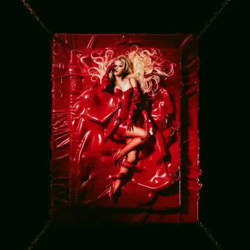 ▲蔡依林（如圖）〈DIY〉性感照曝！血紅馬甲躺床挑逗　喊話：成為身體主人。（圖／凌時差音樂提供）