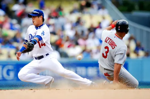 ▲胡金龍在2008年5月25日擔任先發游擊手，當天正好是洛杉磯道奇隊傳奇投手柯蕭（Clayton Kershaw）初登板，胡金龍當天4打數無安打。（圖／美聯社／達志影像）