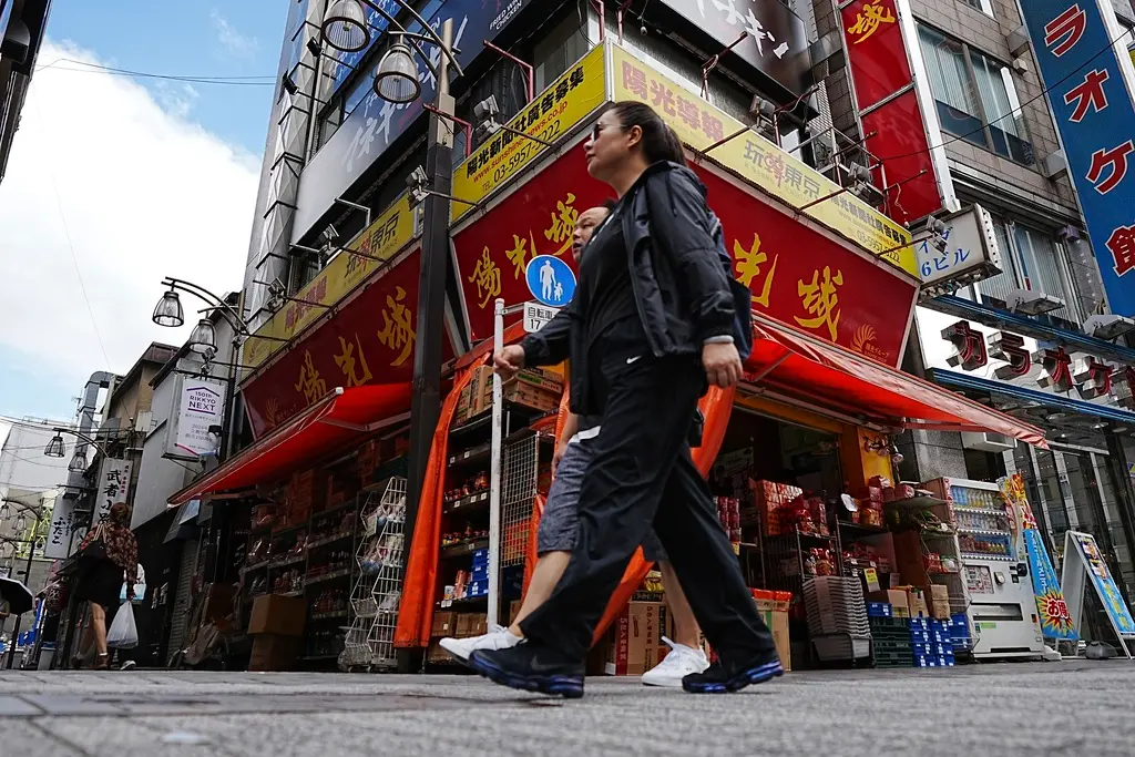 ▲新冠疫情之後，中國人大舉「潤」日，並且在當地購入房產。（圖／美聯社／達志影像）