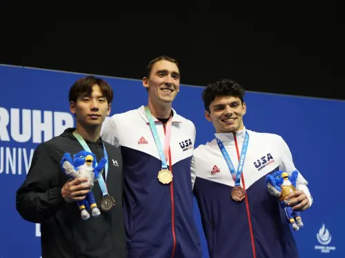 決賽過程中,王冠閎遭遇來自美國的兩大強敵Jack Dahlgren與Mason Laur夾擊,雖然最後100公尺全力加速,但仍以0.26秒的些微差距錯失金牌,與夢想擦肩而過。(圖/大專體總提供) ▲決賽過程中,王冠閎遭遇來自美國的兩大強敵Jack Dahlgren與Mason Laur夾擊,雖然最後100公尺全力加速,但仍以0.26秒的些微差距錯失金牌,與夢想擦肩而過。(圖/大專體總提供)