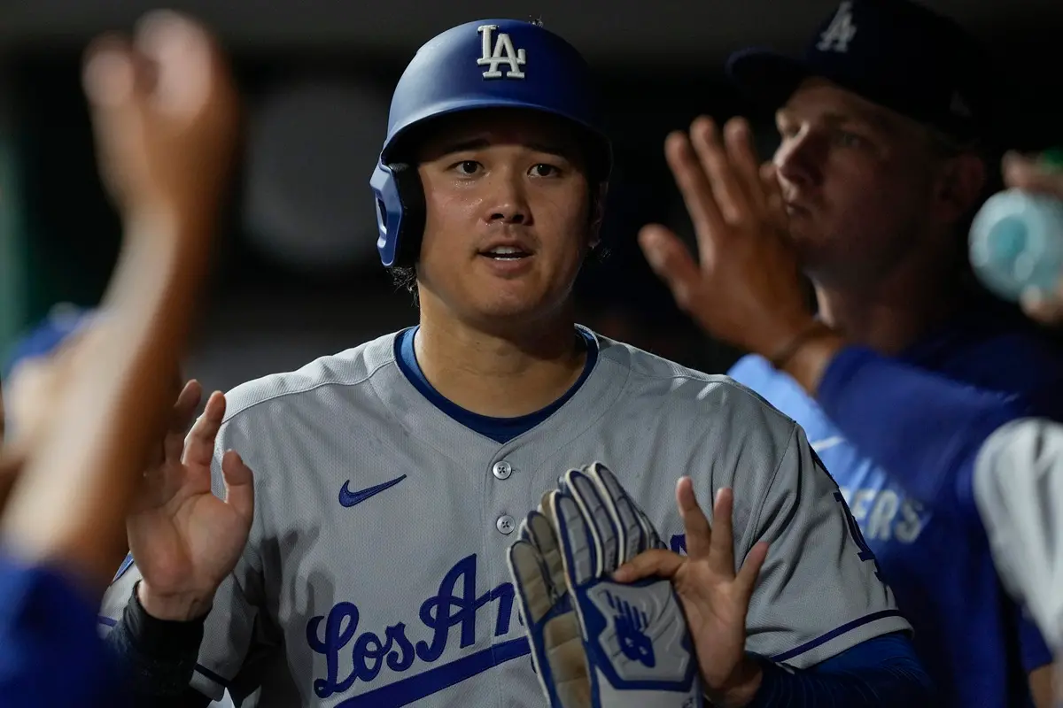 ▲杉磯道奇球星大谷翔平於美國時間7月28日對戰辛辛那提紅人隊的比賽中，以先發第二棒、指定打擊身分先發出賽，繳出3打數1安打2打點1得分的表現，達成本季大聯盟最快的「100得分」里程碑。（圖／美聯社／達志影像）