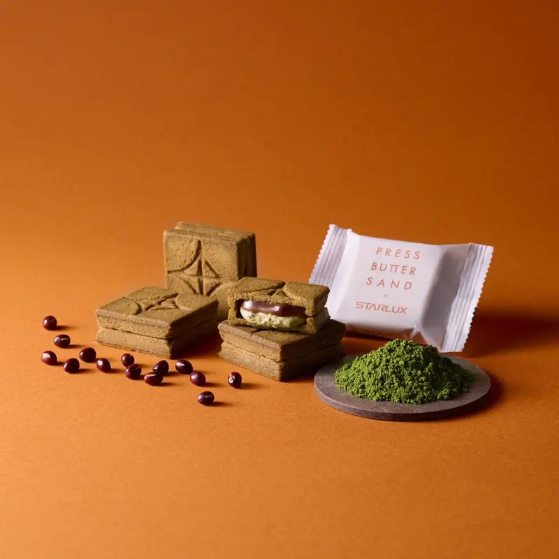    ▲廣受日本航線旅客歡迎的PRESS BUTTER SAND也開發全新機上限定口味，宇治抹茶與北海道紅豆，令人難以忘懷！（圖／星宇航空提供  