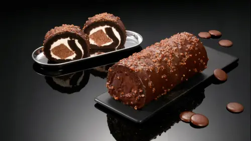 ▲精品級「厄瓜多爾黑巧克力脆皮生乳捲 」，全台每日限量200條，即日起正式開賣。（圖／亞尼克提供）