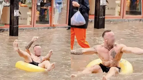 普吉街頭變泳池！外國男泡水取樂　泰網怒批「災情當笑話」

