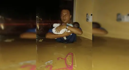 馬來西亞男子胸口深水中抱嬰逃生　暖舉感動全網
