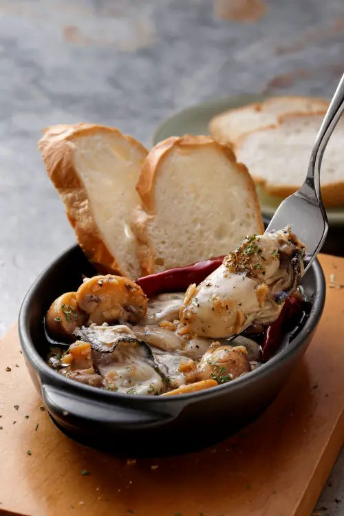 ▲「蒜香油封廣島牡蠣」420元。（圖／慕里諾國際餐飲集團mulino.tw）