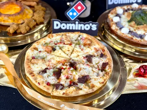 ▲達美樂「頂鮭豪牛雙饗披薩」半價459元優惠。（圖／記者蕭涵云攝）