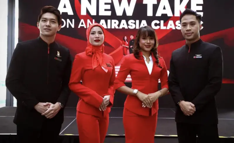 ▲亞航宣布將更新制服規範，未來女空服可依意願戴頭巾並改穿褲裝，引發馬來西亞朝野正面回應。（圖／翻攝自馬新社）