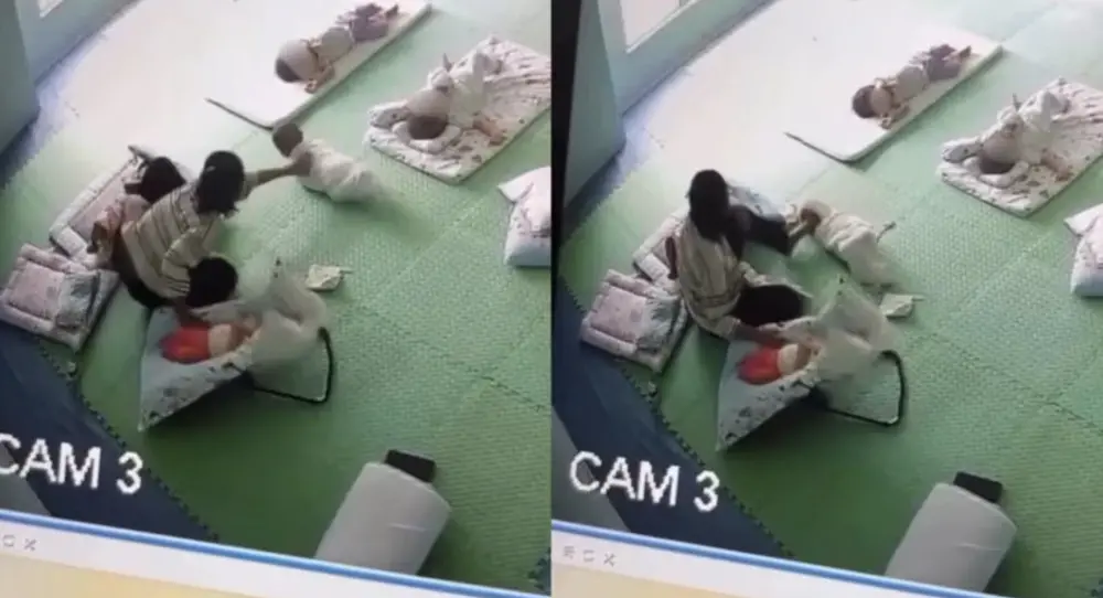 ▲馬來西亞吉隆坡一間托兒所監視器畫面曝光，顯示保姆虐待6個月大的男嬰。（圖／翻攝自NST）