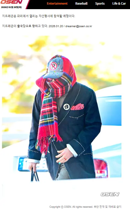 ▲GD拿格紋圍巾把自己的臉圍起來，只露出一雙眼睛。（圖／翻攝自OSEN）