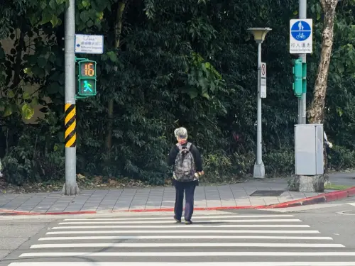 A pedestrian crosses the street. (TCN)