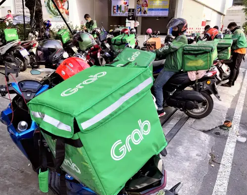 ▲東南亞最大叫車與外送平台Grab將收購foodpanda台灣股權，進軍台灣市場。（圖／美聯社／達志影像）
